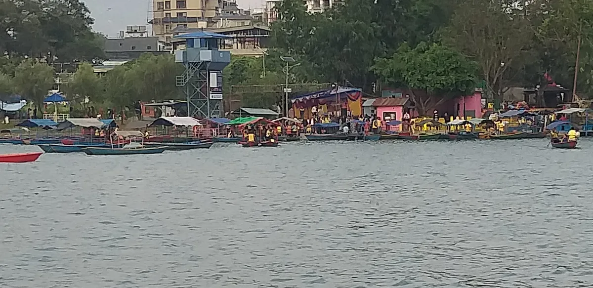 Lakeside Pokhara waterfront with rows of colourful boats