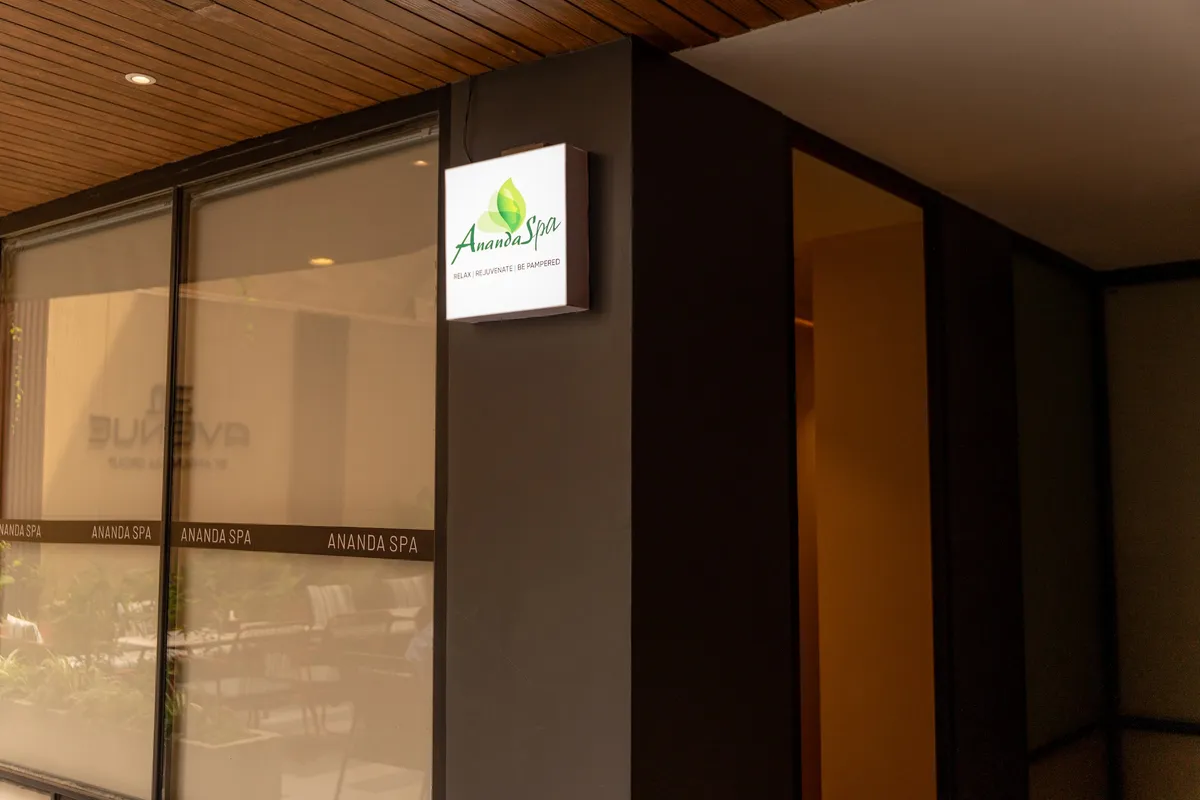Ananda Spa storefront and lit logo on a quiet Lakeside corner